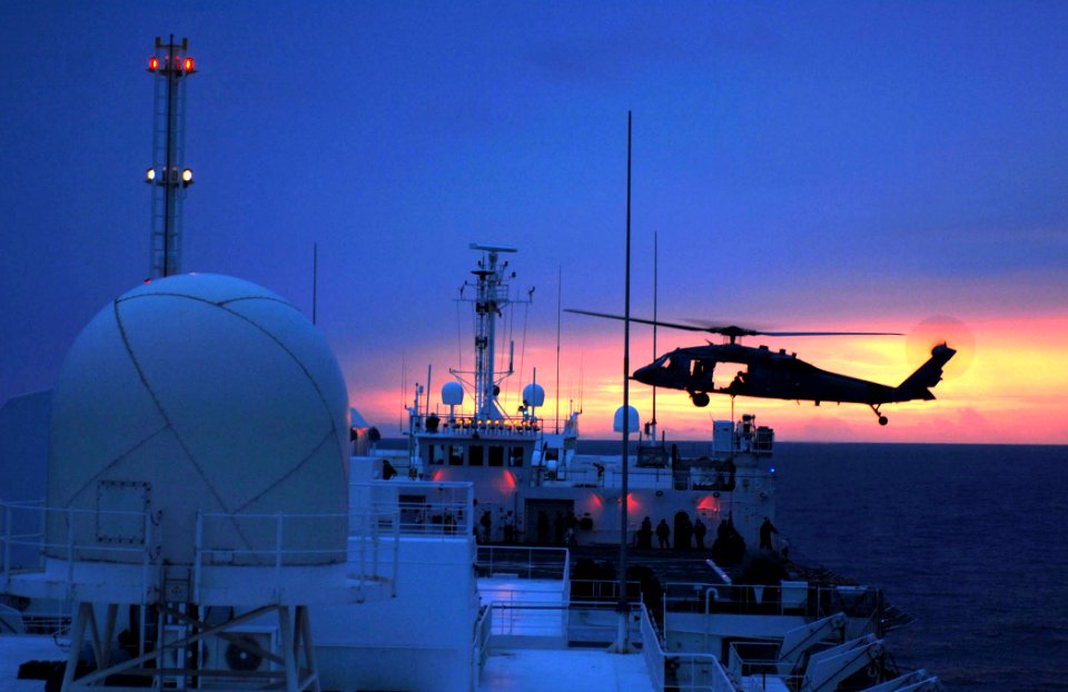 US Navy 070716-N-0194K-137 An MH-60S Seahawk, from Helicopter Sea Combat (HSC) Squadron 28, conducts night vertical replenishment training aboard Military Sealift Command hospital ship USNS Comfort (T-AH 20)