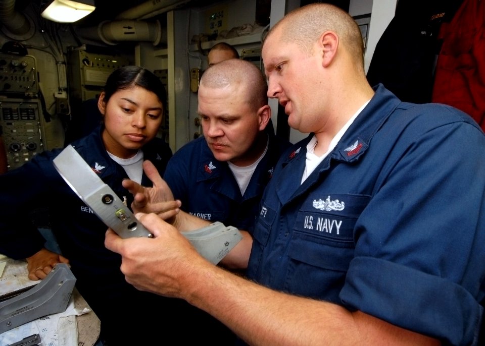 US Navy 070714-N-7981E-061 Sailors assigned to combat systems department inspect repairs made on the gimbal motor of a phase array search antenna for the ship's close-in weapons system aboard Nimitz-class aircraft carrier USS A