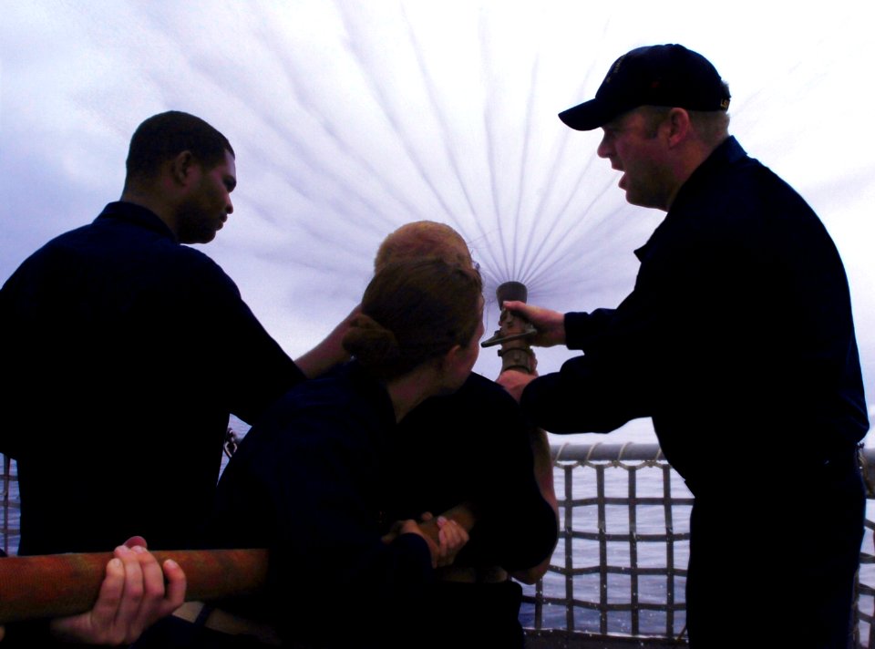 US Navy 070718-N-4163T-106 Sailors stationed aboard dock landing ship USS Germantown (LSD 42) teach midshipmen the proper way to handle a fire hose