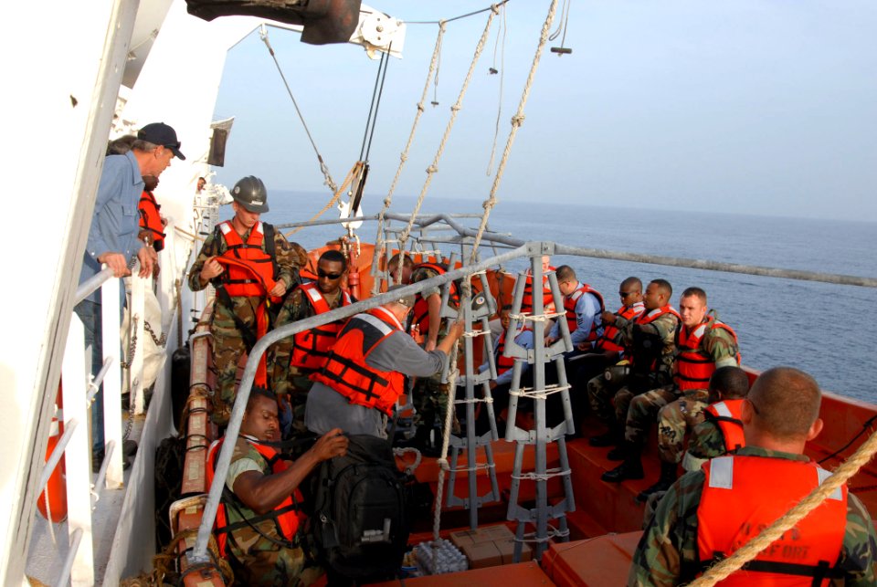 US Navy 070720-N-8704K-009 Seabees attached to Construction Battalion Maintenance Unit (CBMU) 202 depart Military Sealift Command hospital ship USNS Comfort (T-AH 20) via a lifeboat en route to provide assistance to various sit