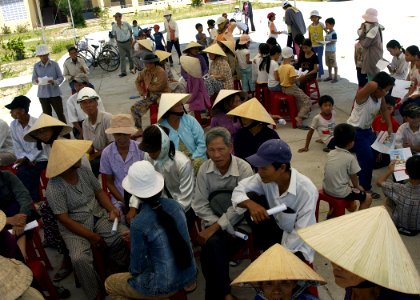 US Navy 070716-N-1752H-039 Local residents wait in line for a routine checkup during a medical civic action program at Truong Tieu Hoc Quy School in support of Pacific Partnership 2007