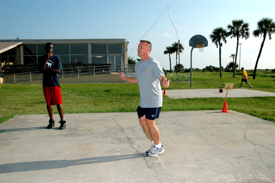 US Navy 070718-N-1522S-002 Command Master Chief Fred Prindle of Helicopter Antisubmarine Squadron Light (HSL) 60, jumps rope as his shipmate keeps count, during one obstacle of the Fitness, Athletic, Strength and Endurance (FAS