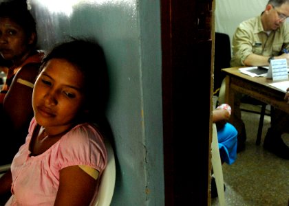 US Navy 070719-N-6278K-043 A patient waits to be seen by Cmdr. Jeff Lowell, U.S. Public Health Service (USPHS), a general surgeon aboard U.S. Navy hospital ship USNS Comfort (T-AH 20) at the Jose Schendal Health Center