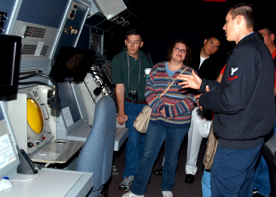US Navy 070718-N-9860Y-006 Air Traffic Controller 3rd Class Kevin Karasti, of Kenosha, Wash., describes the purpose of the precision approach radar to a group of educators from Texas in the air traffic control radar room on boa
