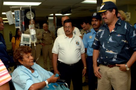 US Navy 070722-N-7088A-004 Ernesto Mendez Zeledon, right, mayor of Corinto, Nicaragua, greets Mireya Zepeda in the intensive care unit following her surgery aboard Military Sealift Command hospital ship USNS Comfort (T-AH 20)