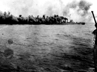 USS Champlin (DD-104) laying a smoke screen, circa in 1920 (NH 85939)