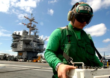 US Navy 070718-N-5928K-010 Aviation Electronics Technician 3rd Class Christopher Denker, of Portland, Ore., uses a Mode-4 control box to check the Identification, Friend or Foe system on an F-A-18F Super Hornet