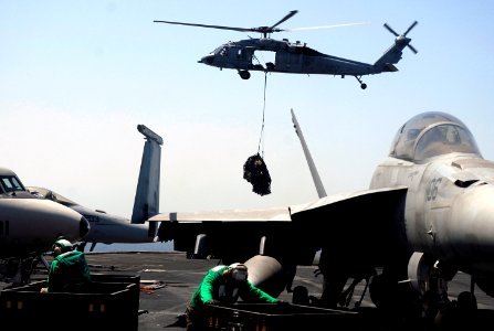 US Navy 070718-N-0890S-018 An MH-60S Seahawk, assigned to the Blackjacks of Helicopter Support Command Squadron (HSC) 21, performs a vertical replenishment with nuclear-powered aircraft carrier USS Nimitz (CVN 68)