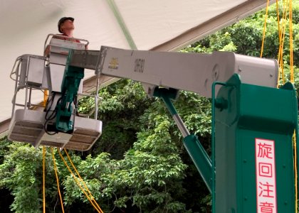 US Navy 070719-N-5253W-002 Construction Electrician Constructionman John Kinghorn, of Naval Mobile Construction Battalion Seven (NMCB 7), runs lines through the frame of a tension fabric structure at the Ikego Housing Compound