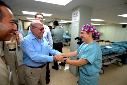 US Navy 070723-N-8704K-075 Nicaraguan Vice President Jaime Morales greets Lt. Cmdr. Tracey Kunkel, operating room division officer, during a tour of Military Sealift Command hospital ship USNS Comfort (T-AH 20) off the coast of