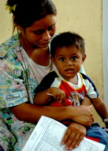 US Navy 070721-N-6278K-052 A patient and her child wait to be seen by Military Sealift Command hospital ship USNS Comfort (T-AH 20) medical staff at 15 de Julio Health Care Center