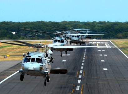 US Navy 070724-N-8907D-429 Five MH-60S Seahawks, from the Sea Knights of Helicopter Sea Combat Squadron (HSC) 22, perform formations over Chambers Field at Naval Station Norfolk