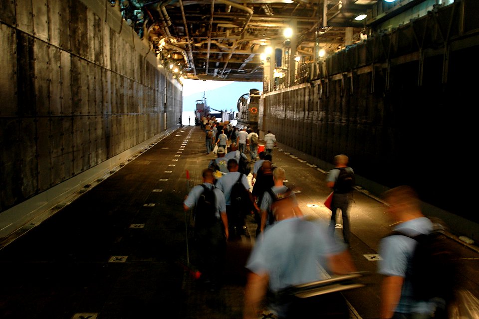 US Navy 070722-N-9421C-003 Members of Pacific Partnership aboard amphibious assault ship USS Peleliu (LHA 5) line up to board a landing craft utility headed to Tien Sa port