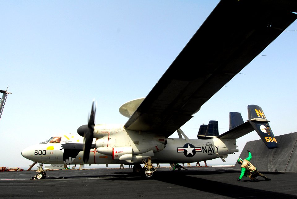 US Navy 070720-N-9760Z-025 Aviation Machinist's Mate 3rd Class Phillip Hamilton signals the E-2C Hawkeye is ready to be launched aboard nuclear-powered aircraft carrier USS Nimitz (CVN 68)
