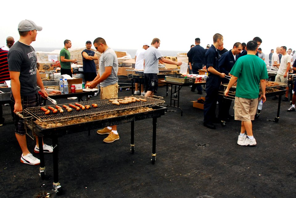 US Navy 070725-N-9760Z-023 Sailors and Marines enjoy a steel beach picnic on the flight deck of nuclear-powered aircraft carrier USS Nimitz (CVN 68)