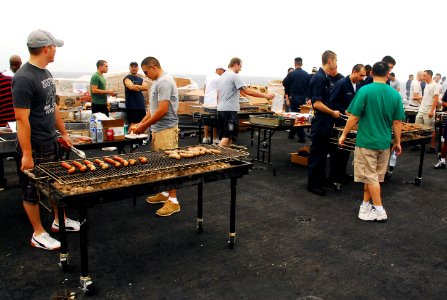 US Navy 070725-N-9760Z-023 Sailors and Marines enjoy a steel beach picnic on the flight deck of nuclear-powered aircraft carrier USS Nimitz (CVN 68)