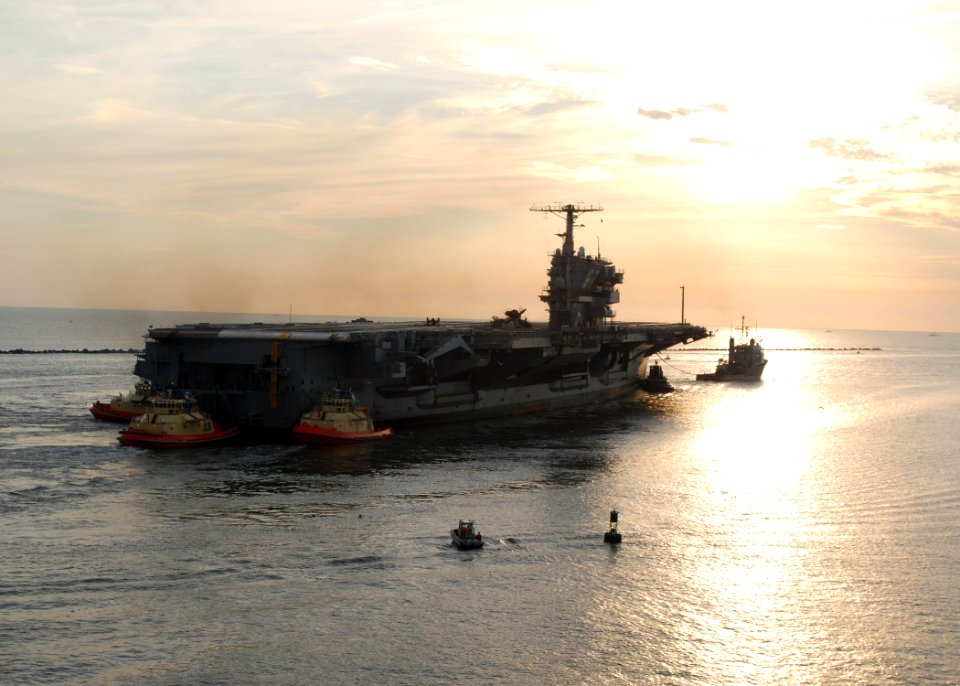 US Navy 070726-N-4565G-010 Decommissioned aircraft carrier John F. Kennedy (CV 67) departs Naval Station Mayport en route to Norfolk, Va