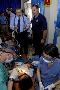 US Navy 070724-N-4954I-128 U.S. Ambassador to Vietnam, the Honorable Michael W. Marine speaks with Capt. Scott Flinn, Pacific Partnership medical commander, about how local patients are being helped at the Nai Hiem Dong Medical