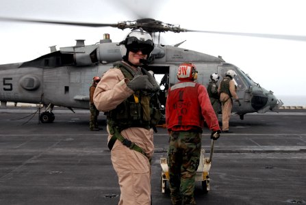 US Navy 070723-N-8119R-250 Capt. David Woods, commander of Carrier Air Wing (CVW) 11, gives a thumbs up after landing on the flight deck of nuclear-powered aircraft carrier USS Nimitz (CVN 68) in an SH-60F Seahawk photo