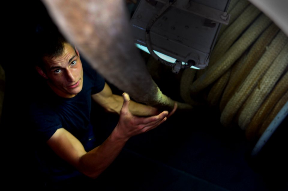 USS Carter Hall sailor tends a line 131024-N-NB538-134