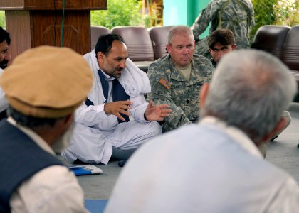US Navy 070725-N-3385W-019 Cmdr. David Adams, commanding officer of Provincial Reconstruction Team Khost, participates alongside Gov. Jamal in forming the provincial development plan with residents from all districts in Khost
