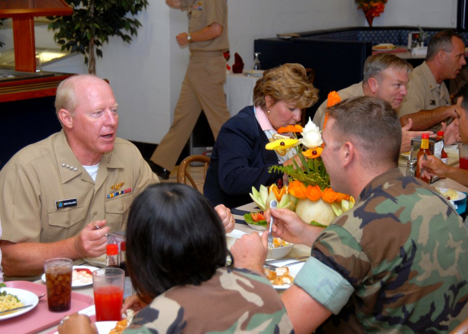 US Navy 070725-N-4096B-023 Adm. Robert Willard, commander of U.S. Pacific Fleet, talks with Builder 3rd Class Gary Blank about his home life and his work schedule while on deployment