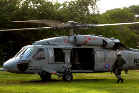 US Navy 070725-N-8704K-165 An MH-60S, attached to Helicopter Sea Combat Squadron (HSC) 28, prepares to take off en route to Military Sealift Command hospital ship USNS Comfort (T-AH 20) photo