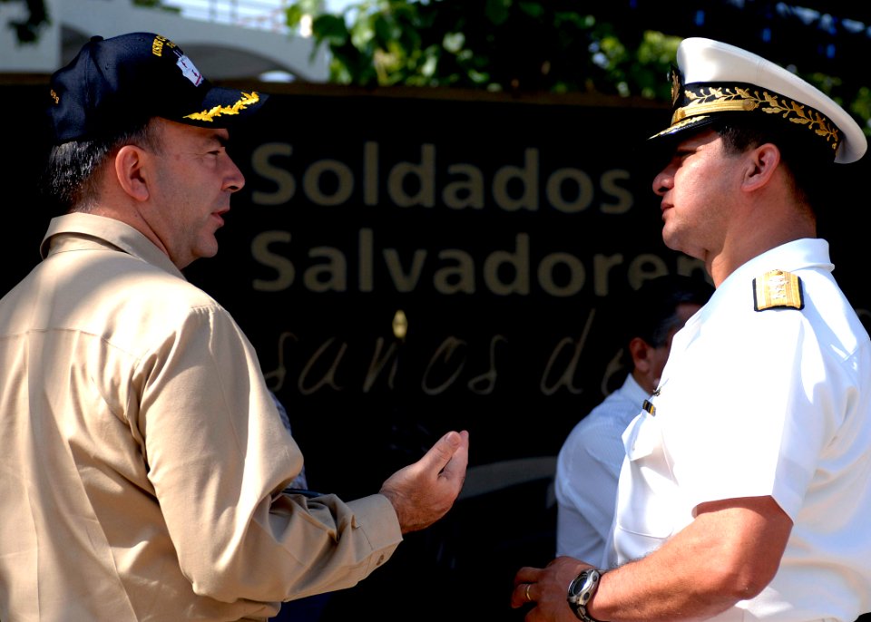 US Navy 070726-N-6278K-024 Capt. Bob Kapcio, mission commander aboard the Military Sealift Command hospital ship USNS Comfort (T-AH 20), speaks to Rear Adm. Palacios, Chief of Naval Operations of the Salvadoran Navy in Acajutla