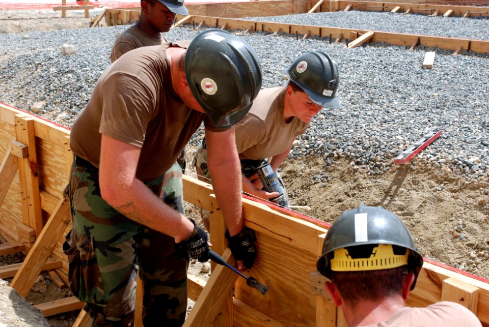 US Navy 070730-A-4352W-016 Seabees from Navy Mobile Construction Battalion 133, assigned to Joint Task Force-Guantanamo, help build a foundation for the new Leedward Airport fire station