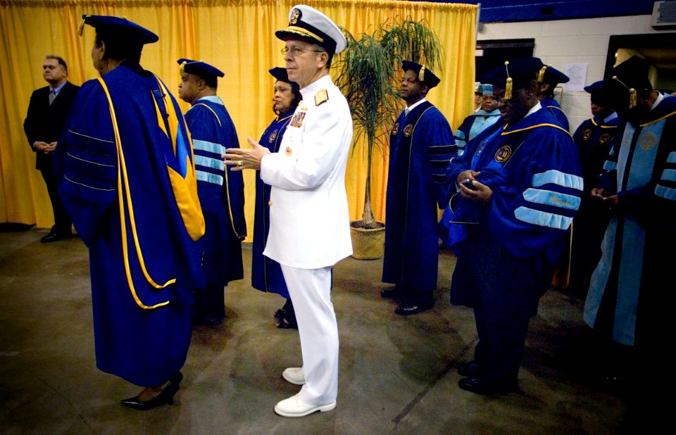US Navy 070727-N-0696M-282 Chief of Naval Operations, (CNO) Adm. Mike Mullen prepares to enter with staff from Southern University to the F.G. Clark Activity Center for commencement exercises