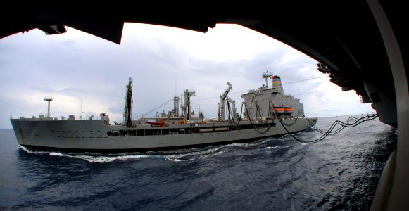 US Navy 070725-N-0455L-006 Military Sealift Command fleet replenishment oiler USNS Laramie (T-AO 203) transits alongside Nimitz-class aircraft carrier USS Harry S. Truman (CVN 75) during a replenishment at sea