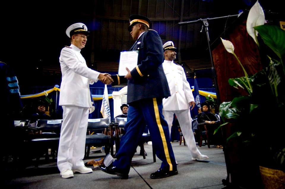 US Navy 070727-N-0696M-068 Chief of Naval Operations, (CNO) Adm. Mike Mullen congratulates newly commissioned 2nd Lt. Stefan Wilson after receiving his degree through the Reserve Officers Training Corps program at Southern Univ