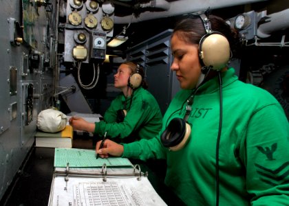 US Navy 070727-N-1229B-003 Aviation Boatswain's Mate (Equipment) Airman Savannah McIntire and Aviation Boatswain's Mate 1st Class Geraldine Lopez ensure that there is enough steam pressure to launch aircraft on catapults