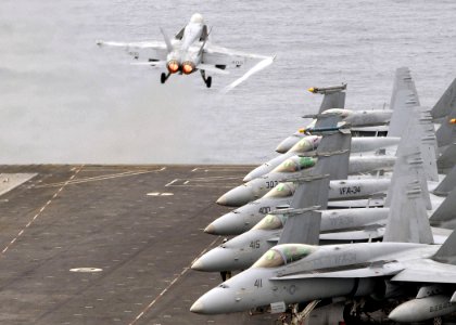 US Navy 070731-N-9898L-009 An F-18C Hornet attached to the Blue Blasters of Strike Fighter Squadron (VFA) 34, is launched off the flight deck aboard Nimitz-class aircraft carrier USS Abraham Lincoln (CVN 72)