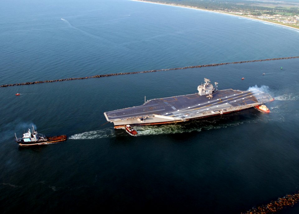US Navy 070726-N-4565G-009 Decommissioned aircraft carrier John F. Kennedy (CV 67) departs Naval Station Mayport en route to Norfolk, Va