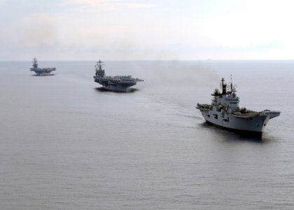US Navy 070729-N-0535P-082 The Royal Navy Invincible-class aircraft carrier HMS Illustrious (R 06), and Nimitz-class aircraft carriers USS Harry S. Truman (CVN 75) and USS Dwight D. Eisenhower (CVN 69) transit in formation