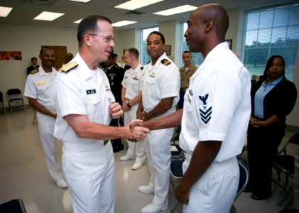 US Navy 070727-N-0696M-244 Chief of Naval Operations, (CNO) Adm. Mike Mullen greets Yeoman 1st Class Isiah Curtis, assigned to the Reserve Officer Training Corps, Southern University prior to giving the commencement speech