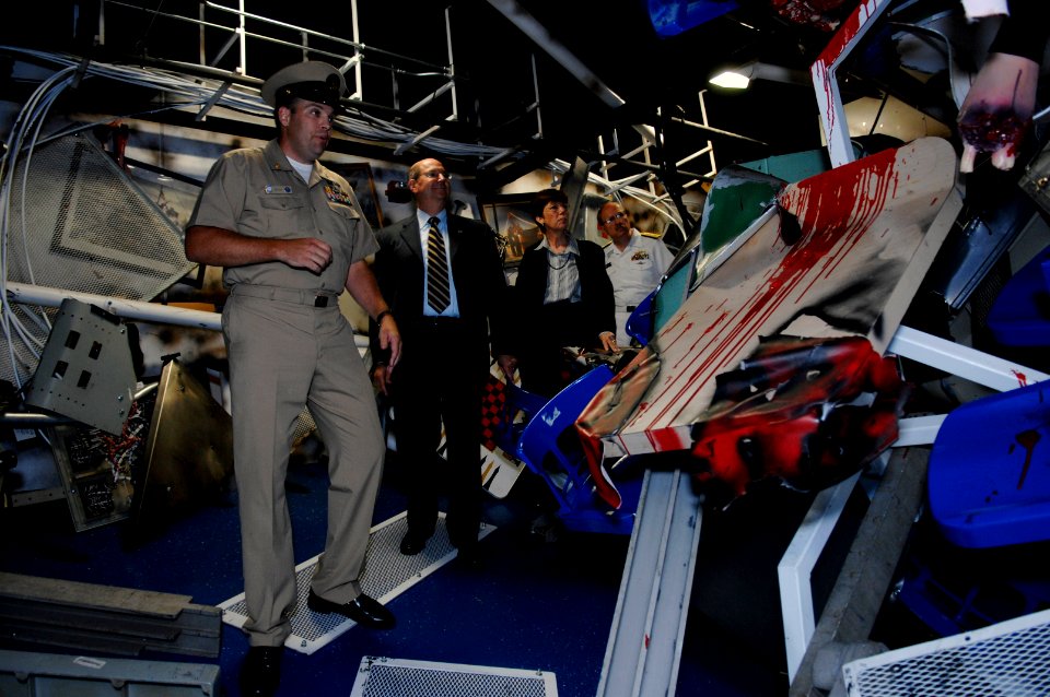 US Navy 070803-N-3642E-067 Secretary of the Navy (SECNAV) the Honorable Dr. Donald C. Winter walks through a simulated damaged berthing space, aboard USS Trayer (BST 21)