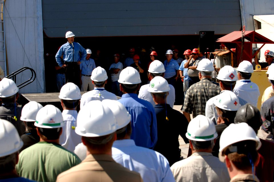 US Navy 070803-N-3642E-708 Secretary of the Navy (SECNAV) the Honorable Dr. Donald C. Winter thanks and encourages the shipfitters at Marinette Marine shipyard during a visit to the yard