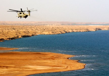 US Navy 070729-N-3285B-026 A CH-53E Super Stallion, attached to Marine Heavy Helicopter Squadron (HMH) 464, flies near the coast of Djibouti photo