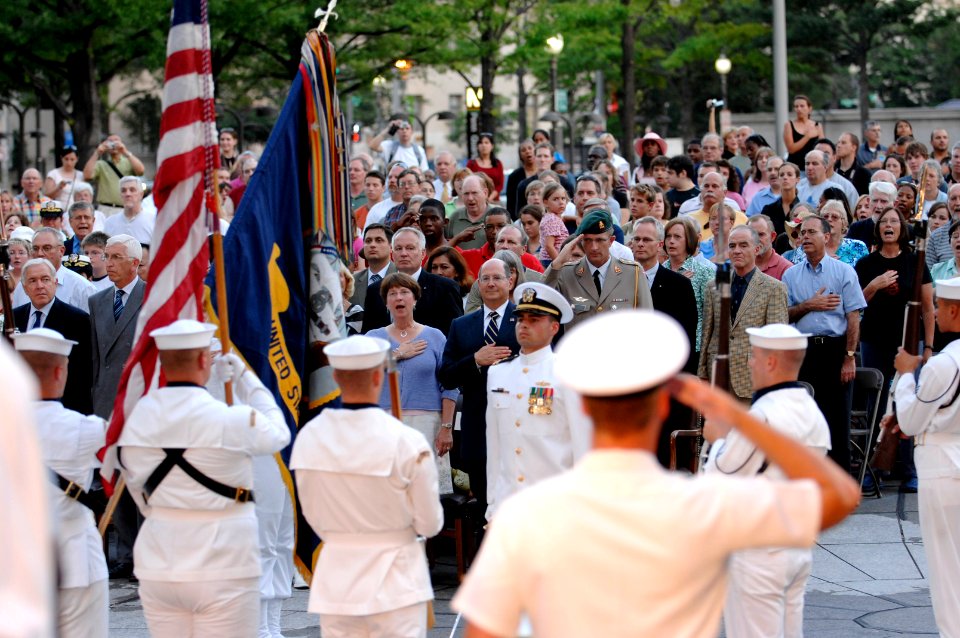 US Navy 070731-N-3642E-198 Secretary of the Navy (SECNAV), the Honorable Dr. Donald C. Winter renders honors during the National Anthem for the commencement of the Navy District Washington's Concert on the Avenue