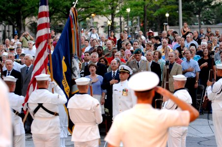US Navy 070731-N-3642E-198 Secretary of the Navy (SECNAV), the Honorable Dr. Donald C. Winter renders honors during the National Anthem for the commencement of the Navy District Washington's Concert on the Avenue photo