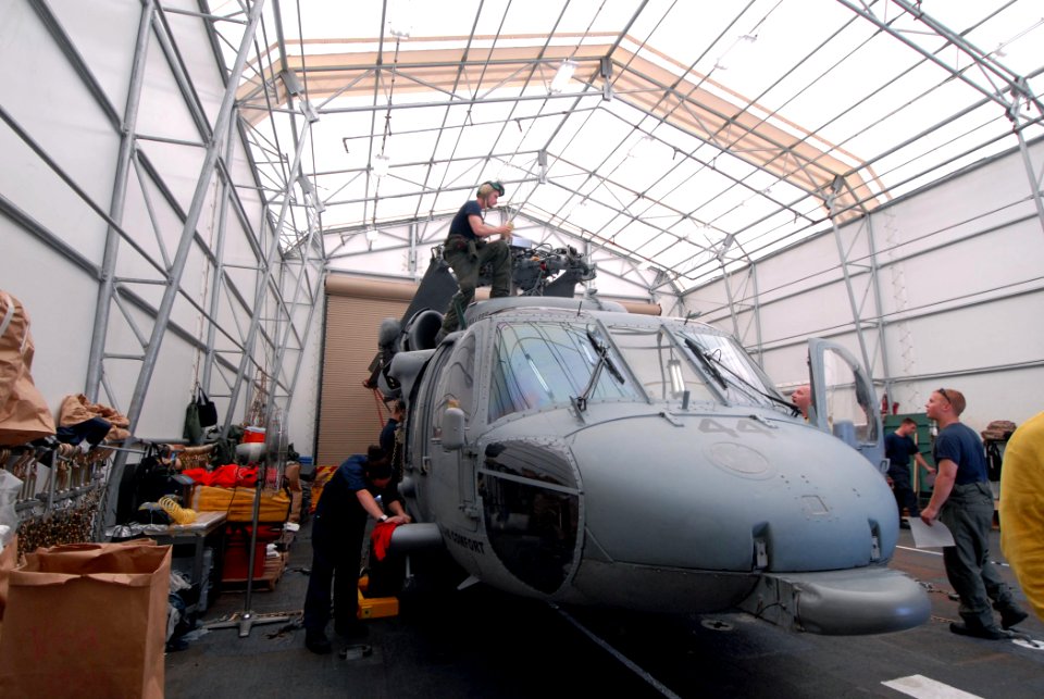 US Navy 070730-N-8704K-102 Maintenance personnel prepare an MH-60S Seahawk from Helicopter Sea Combat Squadron (HCS) 28 for flight aboard hospital ship USNS Comfort (T-AH 20) during a scheduled port visit to Acajutla