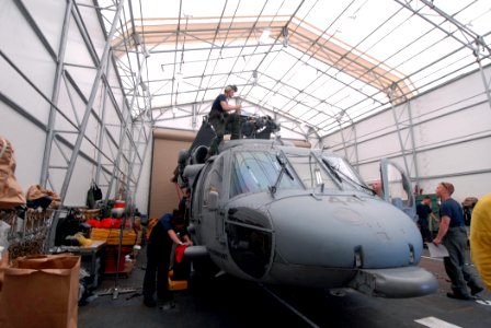 US Navy 070730-N-8704K-102 Maintenance personnel prepare an MH-60S Seahawk from Helicopter Sea Combat Squadron (HCS) 28 for flight aboard hospital ship USNS Comfort (T-AH 20) during a scheduled port visit to Acajutla