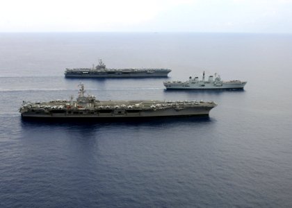US Navy 070729-N-0535P-423 Nimitz-class aircraft carriers USS Dwight D. Eisenhower (CVN 69), USS Harry S. Truman (CVN 75) transit in formation with the Royal Navy's Invincible-class aircraft carrier HMS Illustrious (R 06) in th