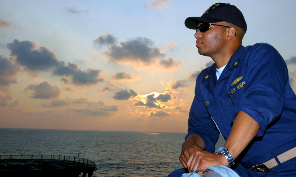 US Navy 070801-N-4014G-225 Lt. Cmdr. Thomas Dixon, executive officer of the guided missile destroyer USS Porter (DDG 78), watches as Porter pulls alongside fast combat support ship USNS Supply (T-AOE 6)