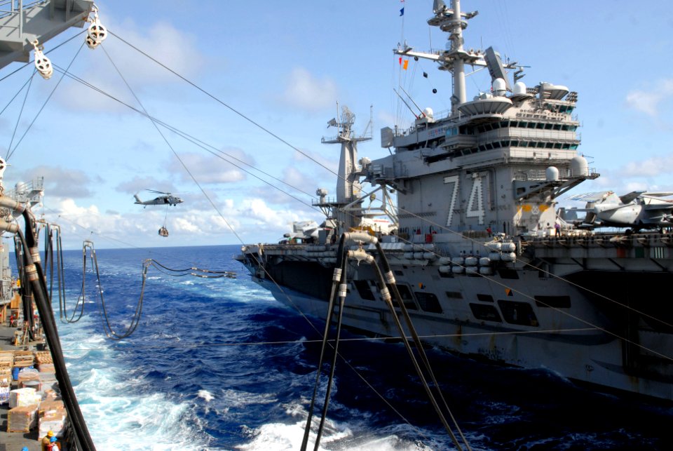 US Navy 070806-N-7498L-193 The Nimitz-Class aircraft carrier USS John C. Stennis (CVN 74) connects span wires and fuel hoses from the Military Sealift Command (MSC) fast combat support ship USNS Bridge (T-AOE 10) during a reple