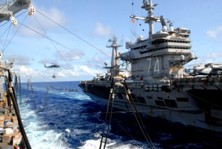 US Navy 070806-N-7498L-193 The Nimitz-Class aircraft carrier USS John C. Stennis (CVN 74) connects span wires and fuel hoses from the Military Sealift Command (MSC) fast combat support ship USNS Bridge (T-AOE 10) during a reple