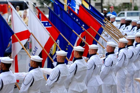 US Navy 070731-N-3642E-201 The Navy Ceremonial Honor Guard renders honors during the National Anthem for the commencement of the Navy District Washington's Concert on the Avenue photo