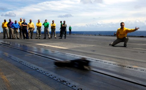 US Navy 070731-N-8923M-022 Lt. Timothy Castro shoots his boots from catapult 3 aboard the Nimitz-class aircraft carrier USS Harry S. Truman (CVN 75) into the Atlantic Ocean